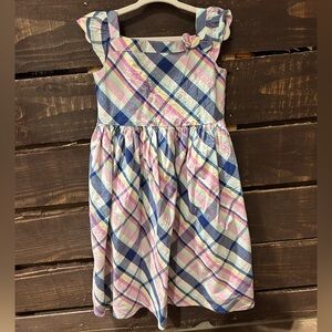 Gymboree 5T dress in pastel plaid with flutter sleevese and bow detail.